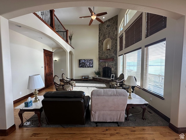 1234 S Parkway Blvd E Unit 725, Saratoga Springs, UT 84045 - living area with a high ceiling, a ceiling fan, and wood finished floors