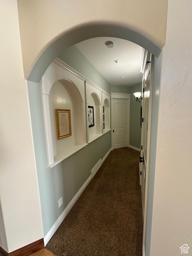 1234 S Parkway Blvd E Unit 725, Saratoga Springs, UT 84045 - hall featuring arched walkways, carpet, and baseboards