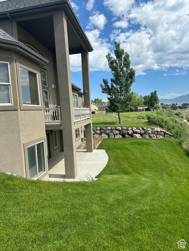1234 S Parkway Blvd E Unit 725, Saratoga Springs, UT 84045 - view of yard with a patio and a balcony