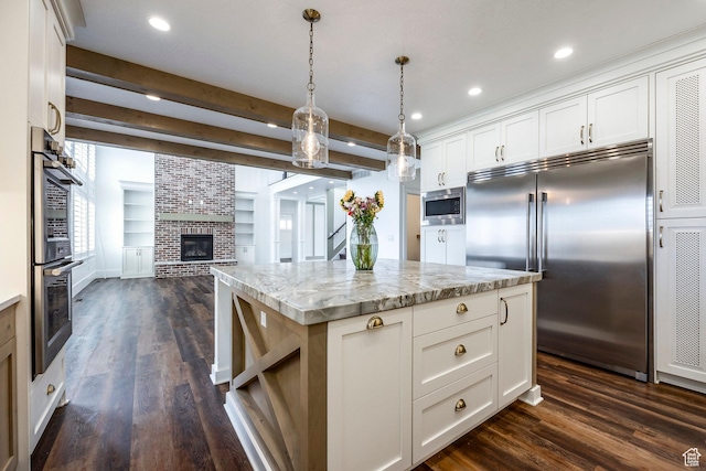 159 E 625 S, Mantua, UT 84324 - kitchen featuring built in appliances, open floor plan, dark wood finished floors, a fireplace, and beam ceiling