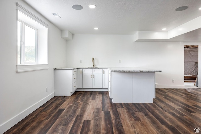 159 E 625 S, Mantua, UT 84324 - kitchen featuring baseboards, a sink, dark wood-type flooring, light stone counters, and recessed lighting