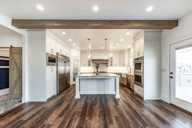 159 E 625 S, Mantua, UT 84324 - kitchen with built in appliances, a center island, a barn door, tasteful backsplash, and beam ceiling