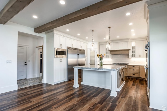 159 E 625 S, Mantua, UT 84324 - kitchen with built in appliances, a kitchen island, beamed ceiling, decorative backsplash, and a kitchen breakfast bar