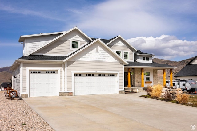 159 E 625 S, Mantua, UT 84324 - view of front facade with a porch, driveway, a garage, and a mountain view