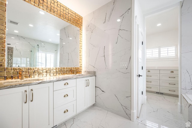 159 E 625 S, Mantua, UT 84324 - bathroom featuring stone wall, marble tiled flooring, double vanity, recessed lighting, and a marble finish shower