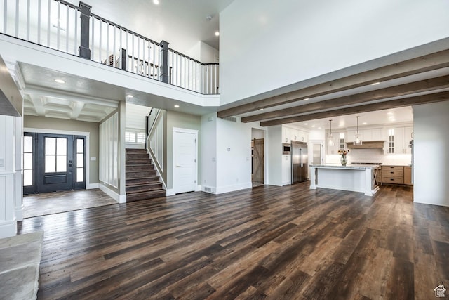 159 E 625 S, Mantua, UT 84324 - unfurnished living room with dark wood finished floors, stairs, baseboards, beamed ceiling, and recessed lighting