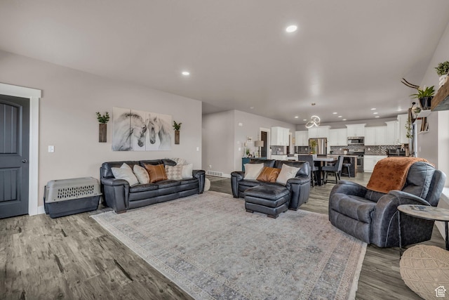 1962 Bluff Crest Rd Unit 4, Francis, UT 84036 - living room featuring recessed lighting, light wood-style floors, and baseboards
