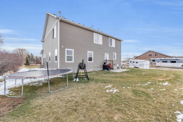 1962 Bluff Crest Rd Unit 4, Francis, UT 84036 - rear view of house featuring a trampoline and a yard