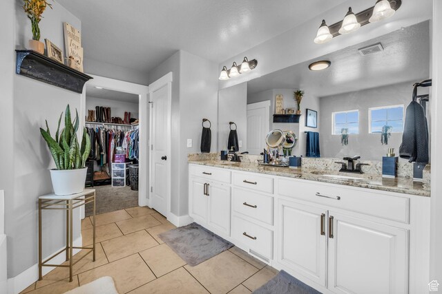 1962 Bluff Crest Rd Unit 4, Francis, UT 84036 - full bathroom with tile patterned floors, double vanity, visible vents, and a sink