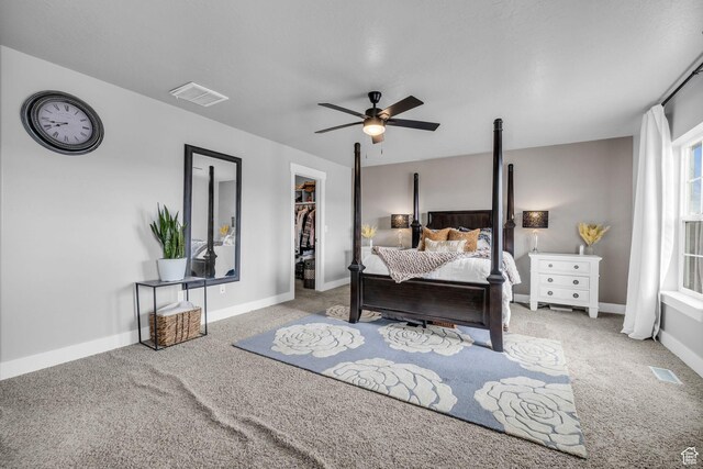 1962 Bluff Crest Rd Unit 4, Francis, UT 84036 - carpeted bedroom featuring visible vents, baseboards, a walk in closet, and a ceiling fan
