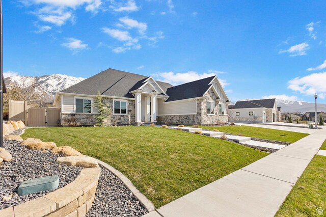 1125 S 400 E, Salem, UT 84653 - view of front of property with a gate, fence, stone siding, a front lawn, and a mountain view