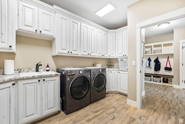 1125 S 400 E, Salem, UT 84653 - laundry area featuring light wood-style floors, separate washer and dryer, a sink, and cabinet space