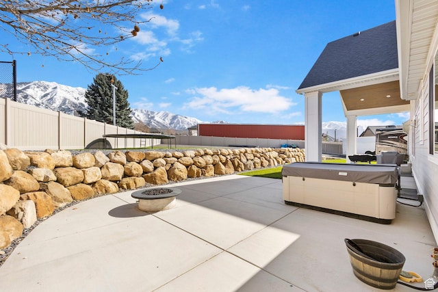1125 S 400 E, Salem, UT 84653 - view of patio / terrace featuring a fenced backyard, a mountain view, and a hot tub