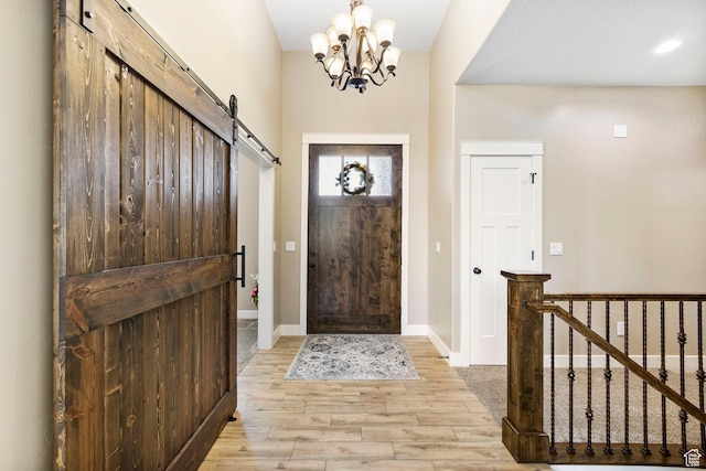 1125 S 400 E, Salem, UT 84653 - foyer entrance with a notable chandelier, light wood-type flooring, a barn door, and baseboards