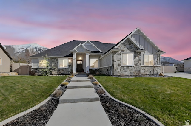 1125 S 400 E, Salem, UT 84653 - view of front of property featuring board and batten siding, a gate, fence, stone siding, and a front lawn