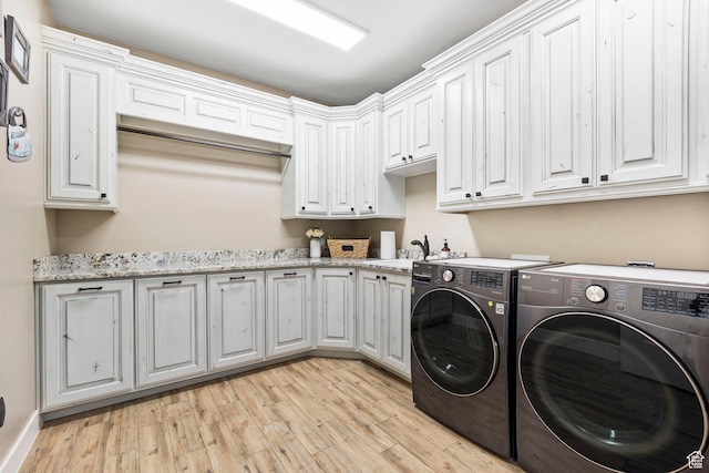 1125 S 400 E, Salem, UT 84653 - laundry room with separate washer and dryer, a sink, light wood finished floors, baseboards, and cabinet space