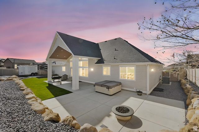 1125 S 400 E, Salem, UT 84653 - back of property at dusk featuring a patio, roof with shingles, cooling unit, a fenced backyard, and a hot tub