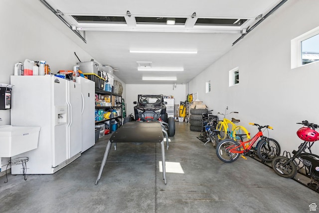 1125 S 400 E, Salem, UT 84653 - garage featuring white refrigerator with ice dispenser