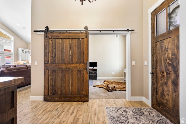 1125 S 400 E, Salem, UT 84653 - foyer entrance featuring baseboards, a barn door, and wood finished floors