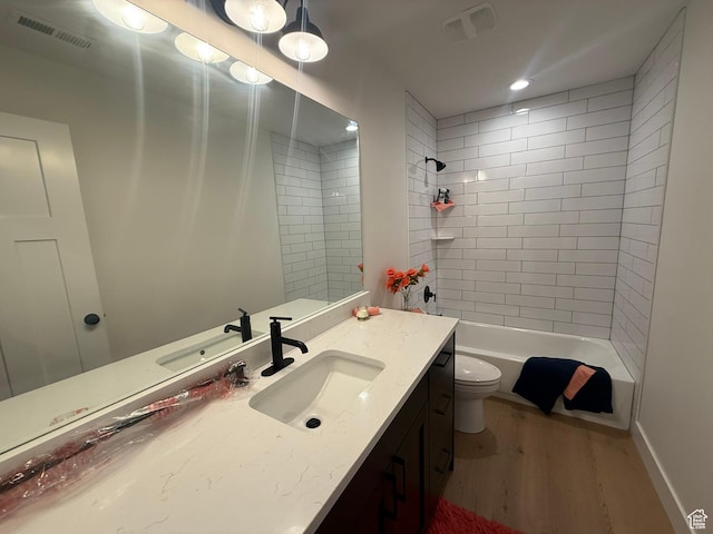 3758 W Alder Ct, Taylor, UT 84401 - bathroom with wood finished floors, visible vents, toilet, and vanity
