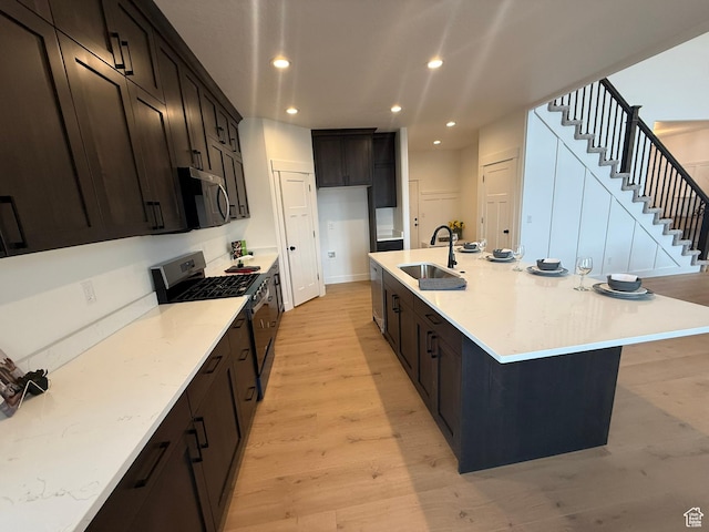 3758 W Alder Ct, Taylor, UT 84401 - kitchen featuring a sink, a large island, stainless steel appliances, light wood-style flooring, and recessed lighting