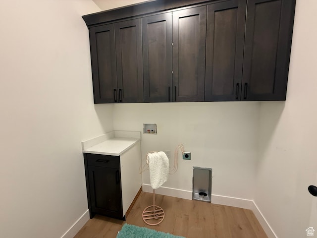 3758 W Alder Ct, Taylor, UT 84401 - clothes washing area with hookup for an electric dryer, baseboards, light wood-style flooring, cabinet space, and washer hookup