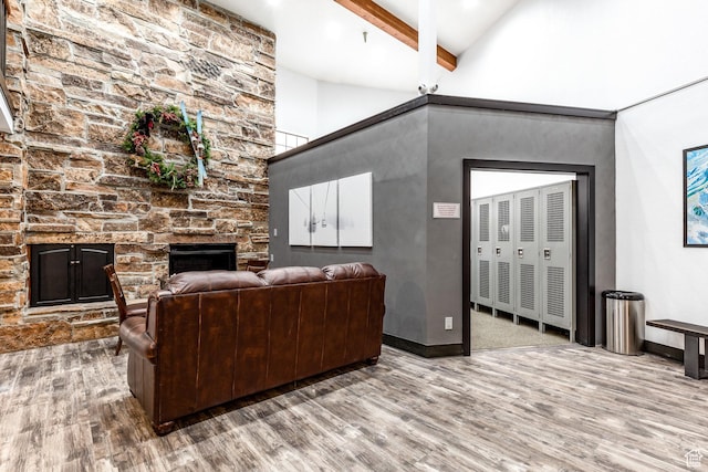 1940 Prospector Ave Unit 101, Park City, UT 84060 - living room with beamed ceiling, baseboards, wood finished floors, and a fireplace