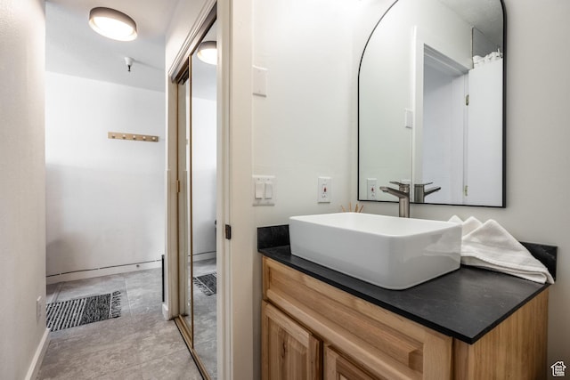 1940 Prospector Ave Unit 101, Park City, UT 84060 - bathroom featuring visible vents, baseboards, and vanity