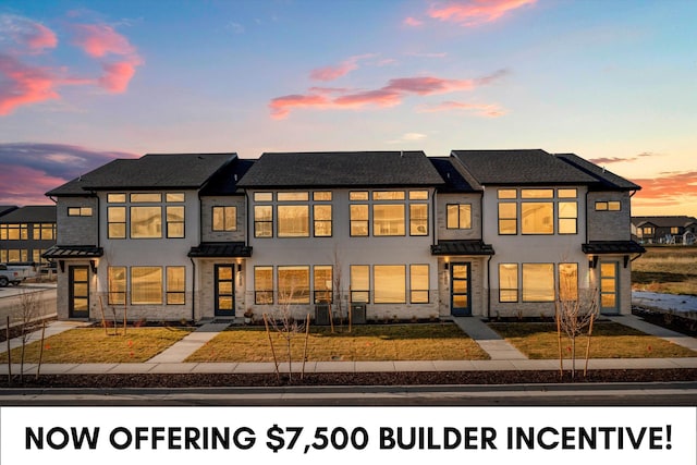 4342 W 5430 S Unit A, Hooper, UT 84315 - townhome / multi-family property with a standing seam roof, stucco siding, metal roof, stone siding, and a shingled roof