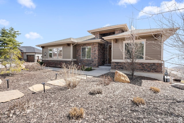 prairie-style home with stone siding