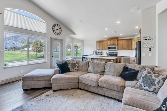 4071 S Sandpiper Ln, Saratoga Springs, UT 84045 - living area with a wealth of natural light, light wood-type flooring, high vaulted ceiling, and recessed lighting