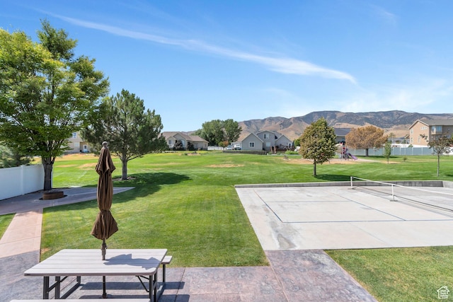 4071 S Sandpiper Ln, Saratoga Springs, UT 84045 - view of yard featuring a residential view, a mountain view, a tennis court, and fence