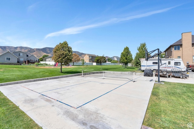 4071 S Sandpiper Ln, Saratoga Springs, UT 84045 - surrounding community with a mountain view, a lawn, a tennis court, fence, and a residential view