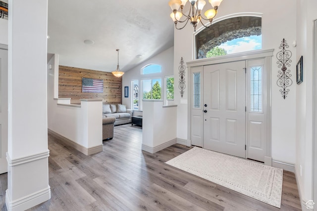 4071 S Sandpiper Ln, Saratoga Springs, UT 84045 - foyer entrance with a chandelier, wood finished floors, high vaulted ceiling, and baseboards