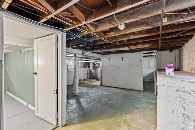 unfinished basement featuring washer / dryer