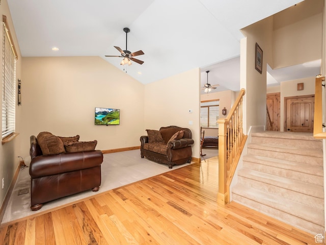 1411 S Slate Canyon Dr, Provo, UT 84606 - living room featuring ceiling fan, wood finished floors, vaulted ceiling, stairway, and baseboards