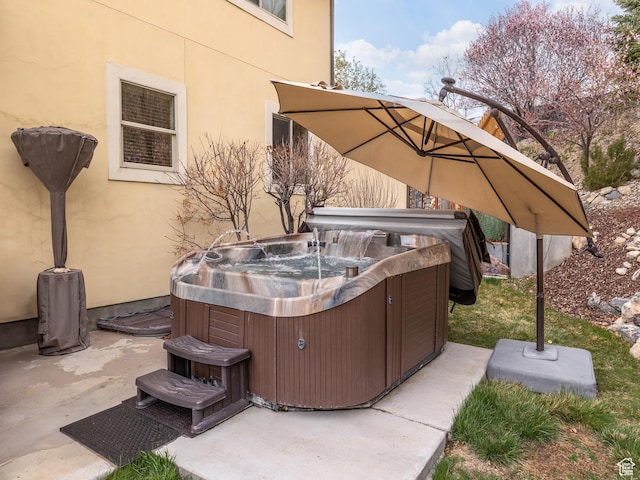 view of patio / terrace featuring central AC unit and a hot tub