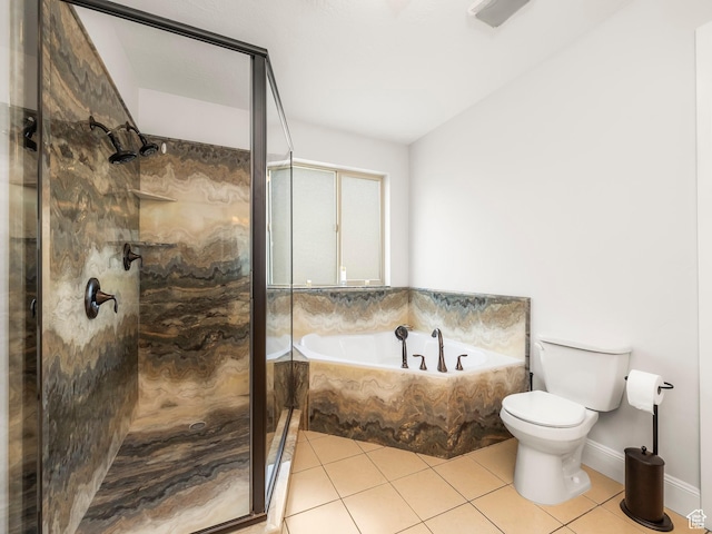 bathroom featuring a bath, toilet, a shower stall, and tile patterned flooring