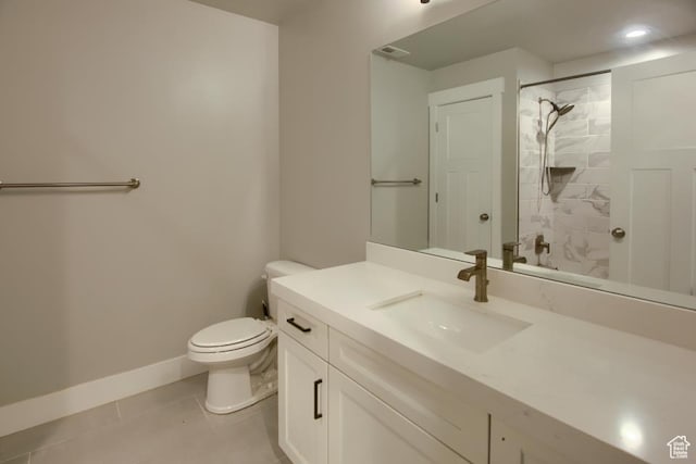 full bath featuring baseboards, walk in shower, toilet, vanity, and tile patterned floors