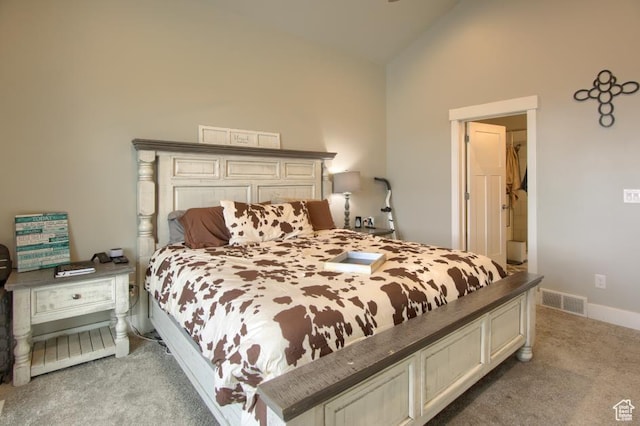 bedroom featuring visible vents, baseboards, light carpet, and lofted ceiling