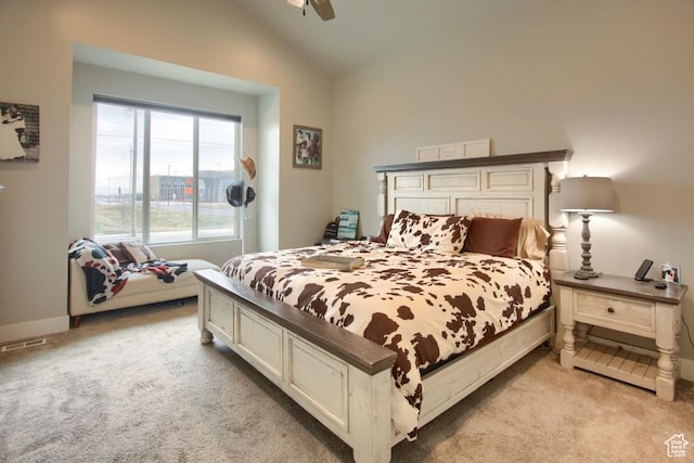 bedroom with visible vents, baseboards, ceiling fan, light colored carpet, and lofted ceiling