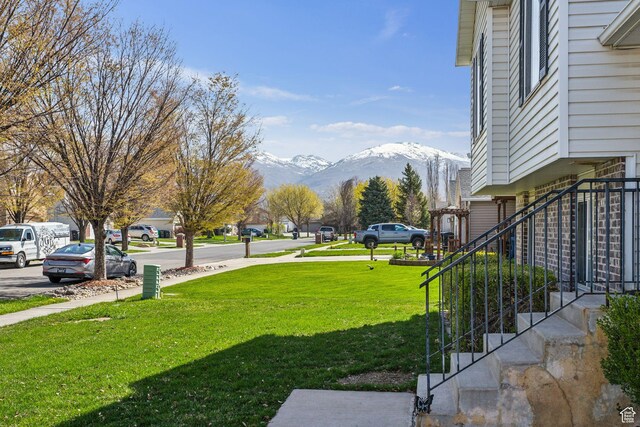 view of yard with a mountain view and stairway