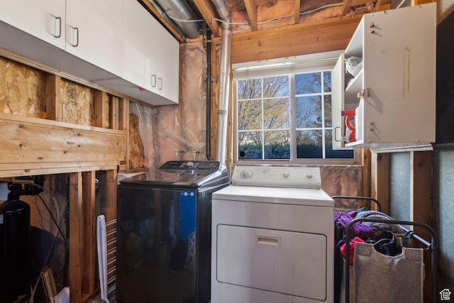 laundry area featuring cabinet space and washing machine and clothes dryer