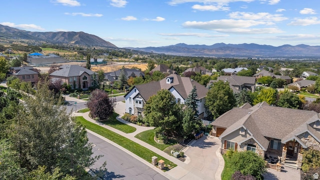 birds eye view of property with a residential view and a mountain view