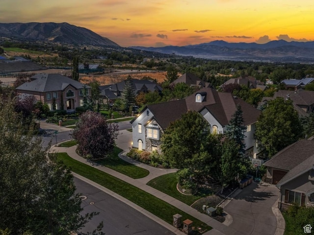 drone / aerial view featuring a mountain view and a residential view