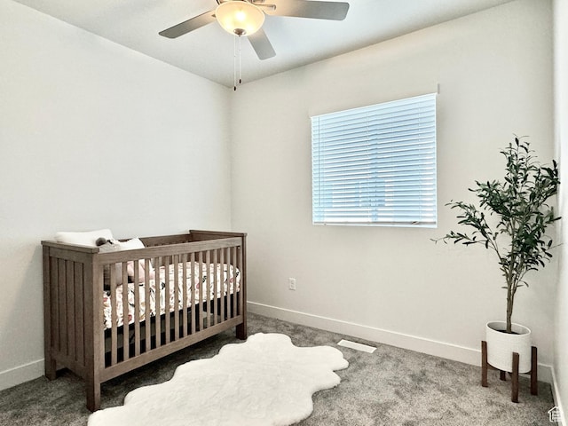 2321 W Leigh Ln Unit M55, West Haven, UT 84401 - carpeted bedroom with a nursery area, baseboards, and ceiling fan