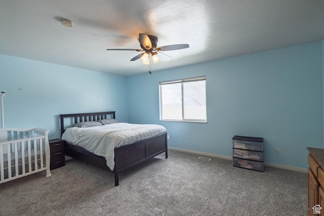 bedroom with carpet flooring, baseboards, and a ceiling fan