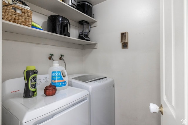 washroom featuring independent washer and dryer and laundry area