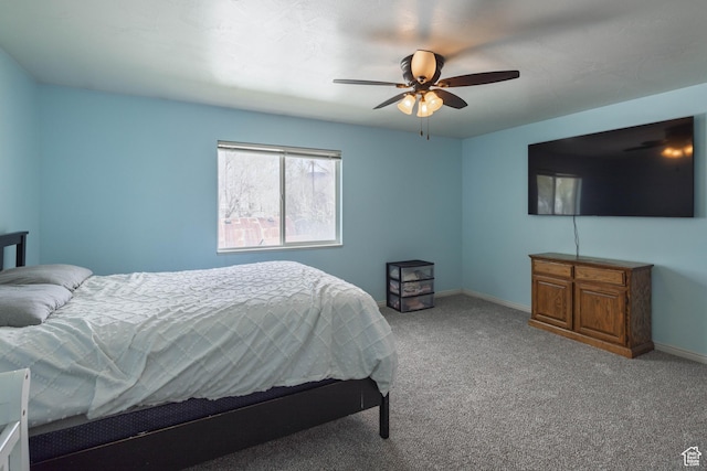 bedroom with carpet flooring, baseboards, and a ceiling fan