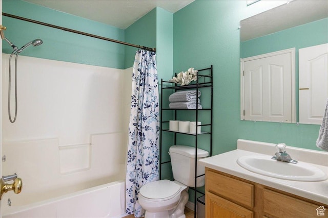 full bath featuring toilet, vanity, and shower / bath combo with shower curtain